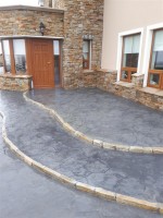 Gradiated layers around house in  pattern imprinted concrete by GM Hard Landscapes, County Donegal, Ireland